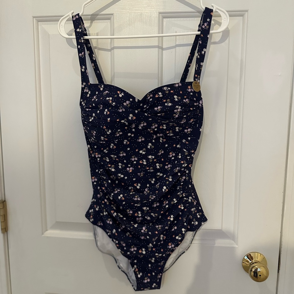 Nip tuck swim. Navy blue with tiny flowers.